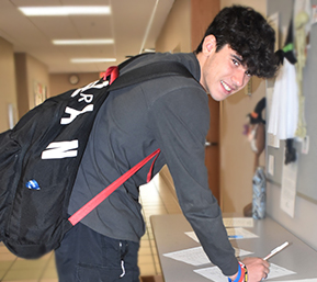 Decorative image of PSC student pictured walking in the hallway
