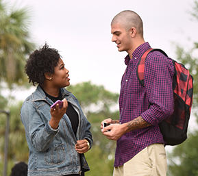 Decorative image of two PSC students talking together outside