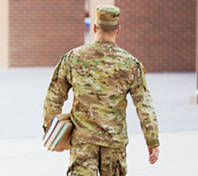 Decorative image of man in military uniform holding textbooks walking on campus