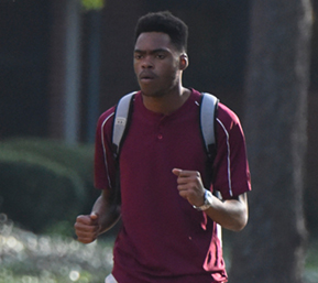 Decorative image of PSC student walking on campus